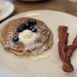 This is the smaller portion of pancakes and added blueberries. This is the smaller portion of pancakes and added blueberries.