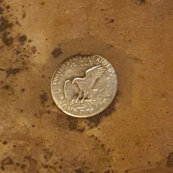Sweetwater Bar-B-Que - A few silver dollars embedded in the flooring. - Barbeque Near Me - St. Robert, Missouri