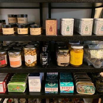 Curds & Co - a shelf full of food items - Cheese Shops Near Me - Brookline, Massachusetts