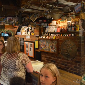 The Open Kitchen - Front Desk with Campaign Button Collection Behind - Italian Near Me - Charlotte, North Carolina