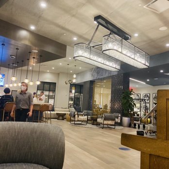 The Silver King Coastal Kitchen - Cozy couch view by Entrance - New American Near Me - Fort Myers, Florida