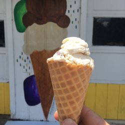 Southern Sweets - Single scoop (almost) of butter pecan on waffle cone.