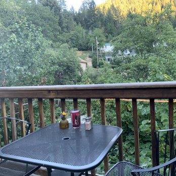 La Cocina De Oro - a table and chairs on a balcony - American Near Me - Downieville, California