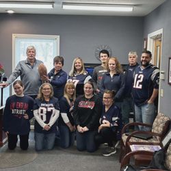 Amherst Insurance - Team photo wearing New England Patriots gear
