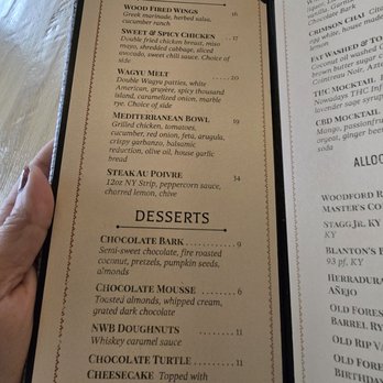 The Clifton - Menu - A menu page lists food features like wood-fired wings, sweet & spicy chicken, Wagyu melt, Mediterranean bowl, and steak au poivre, along with desserts including chocolate bark, mousse, doughnuts, turtle, and cheesecake. - Pizza Near Me - Plainfield, Illinois