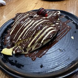 D Spot - Gluten-free crepe stuffed with strawberries and bananas and drizzled with dark chocolate