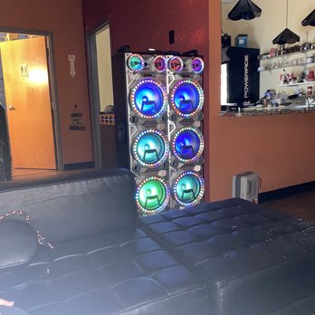 Ihookka Lounge - a black leather couch with a colorful backlight - Hookah Bars Near Me - Marietta, Georgia