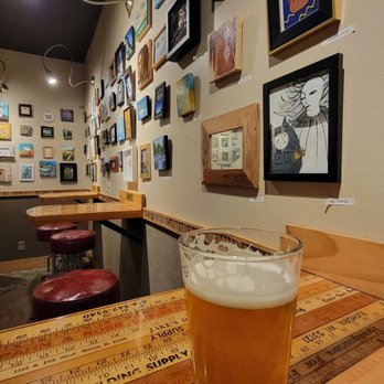 Art Bar - a pint of beer on a wooden table - Bars Near Me - Milwaukee, Wisconsin