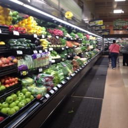 people shopping in a grocery store people shopping in a grocery store