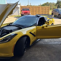 AAMCO Transmissions & Total Car Care - A yellow Corvette in the service area at AAMCO St. Augustine, where our team handles diagnostics, repairs and car care.