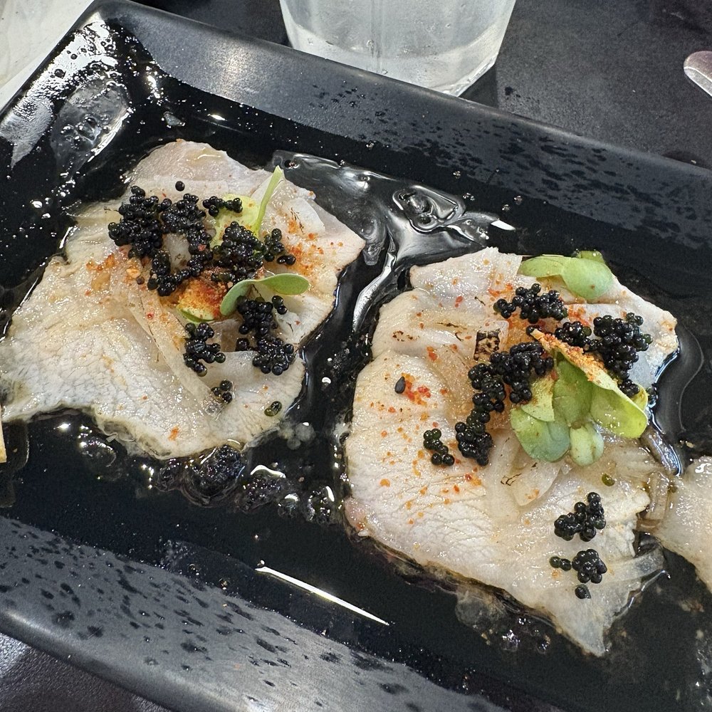 Hamachi Crudo that is NOT RAW, they torch it. So the only thing crudo would be the garnishes. Hamachi Crudo that is NOT RAW, they torch it. So the only thing crudo would be the garnishes.