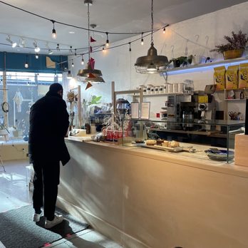 R and G Coffee - a man standing at a counter - Nurseries & Gardening Near Me - Toronto, Ontario