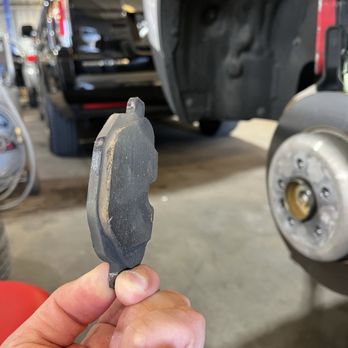 Innovation Motorsport - Old dusty worn down rear brake pad - Auto Repair Near Me - Ceres, California