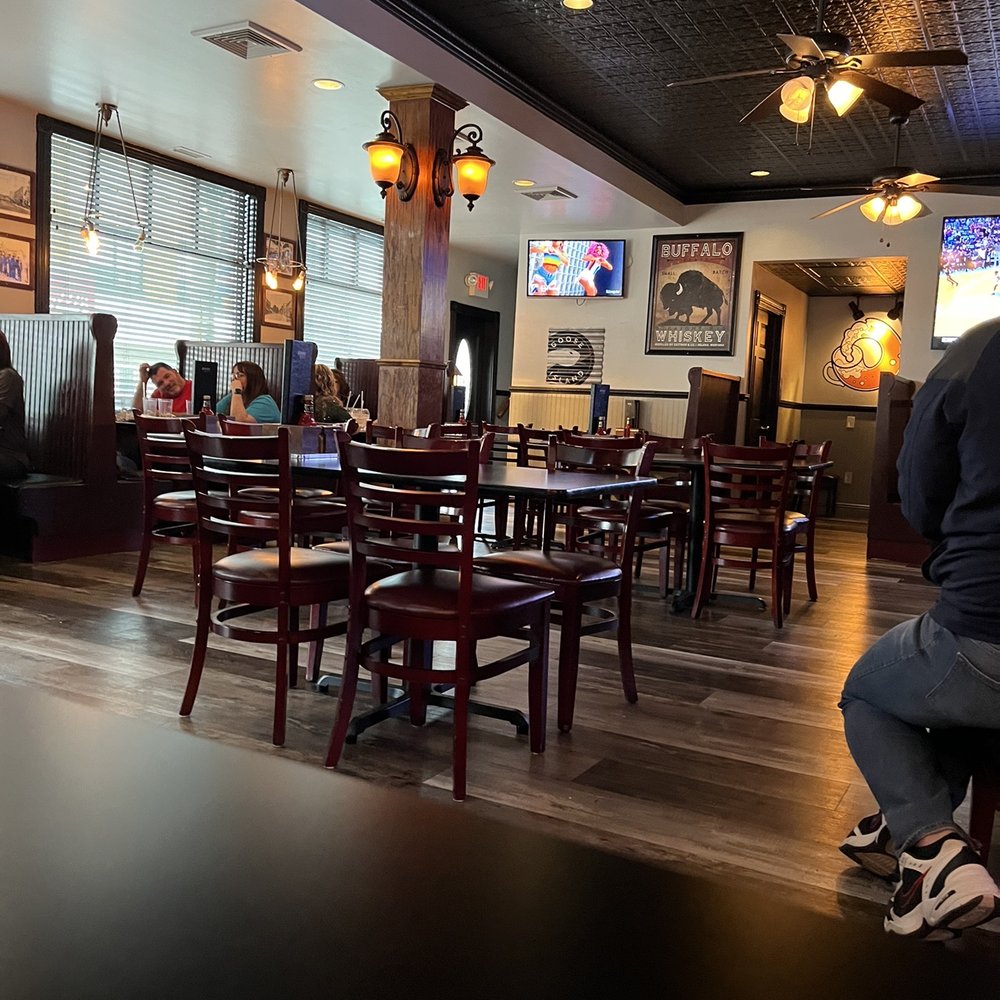 Queen City Tavern - a man sitting at a table in a restaurant - American Near Me - Olyphant, Pennsylvania Queen City Tavern - a man sitting at a table in a restaurant - American Near Me - Olyphant, Pennsylvania