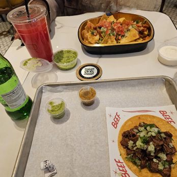 Roadside Taco - Nachos and a steak taco along withe watermelon Agua fresca and mexican squirt. - Mexican Near Me - Las Vegas, Nevada Roadside Taco - Nachos and a steak taco along withe watermelon Agua fresca and mexican squirt. - Mexican Near Me - Las Vegas, Nevada