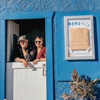 Pie in the Sky - Owners with sold out sign - Pizza Near Me - Cayucos, California
