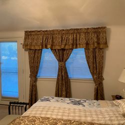 Spotless Housecleaning & More - Curtains in master bedroom washed and hung back up