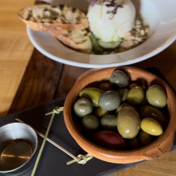 Perro Negro Taperia - a bowl of olives and a bowl of ice cream - Tapas/Small Plates Near Me - Victoria, British Columbia Perro Negro Taperia - a bowl of olives and a bowl of ice cream - Tapas/Small Plates Near Me - Victoria, British Columbia