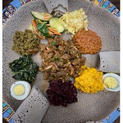 Natoli Cafe - Combo dish w a beef dish in the center of all vegetarian side dishes delicious little bit spicy, but not too