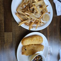 Wild Wings Restaurant & Lounge - My fish and chips with spicy Brussel sprouts. I added  gravy to my fries.