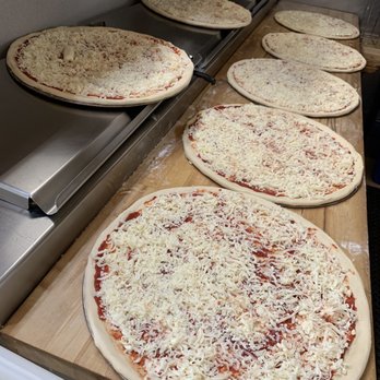 Monza Pizzeria - a row of uncooked pizzas - Pizza Near Me - San Francisco, California Monza Pizzeria - a row of uncooked pizzas - Pizza Near Me - San Francisco, California