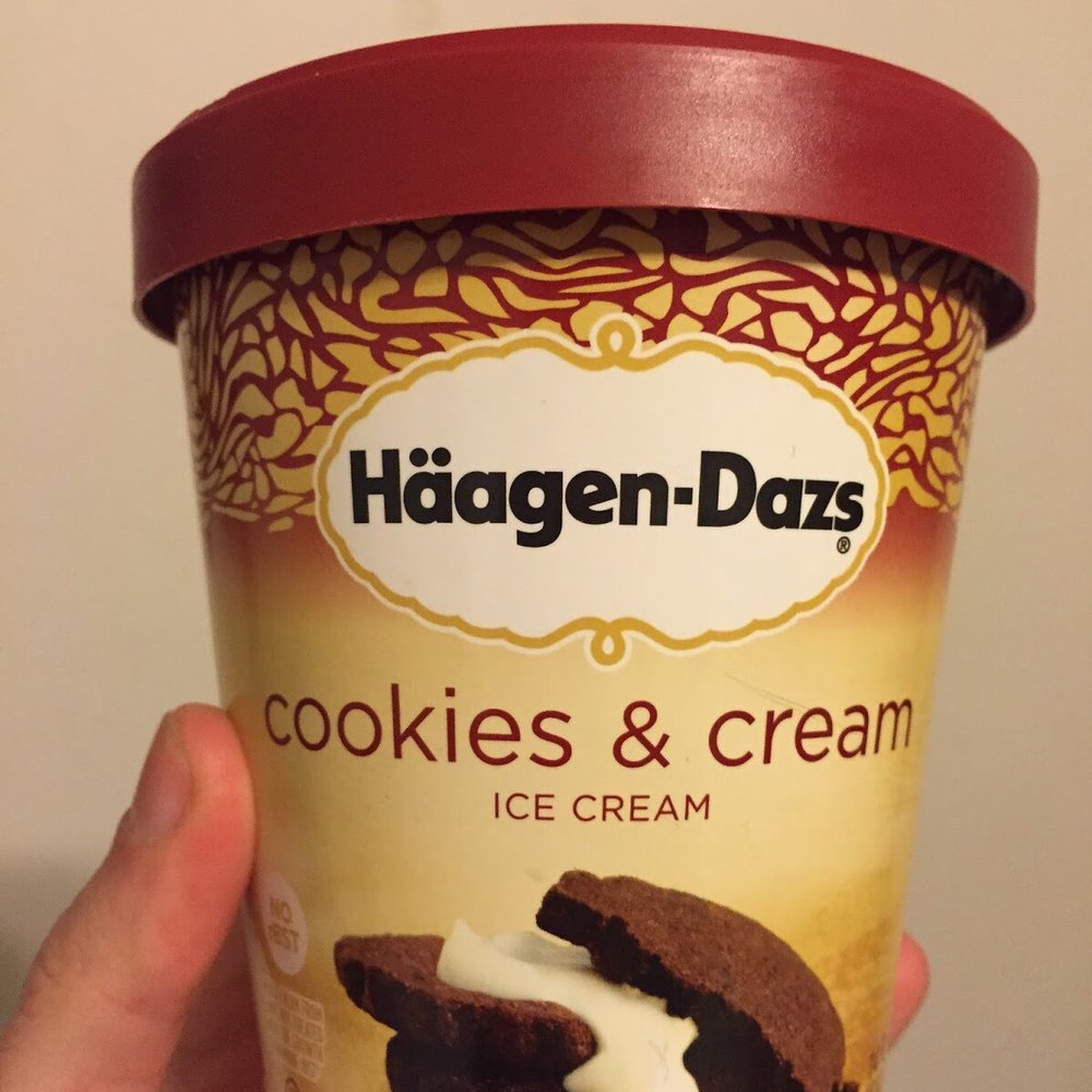 Hagen Daaz - a hand holding a cup of ice cream - Ice Cream & Frozen Yogurt Near Me - Denver, Colorado