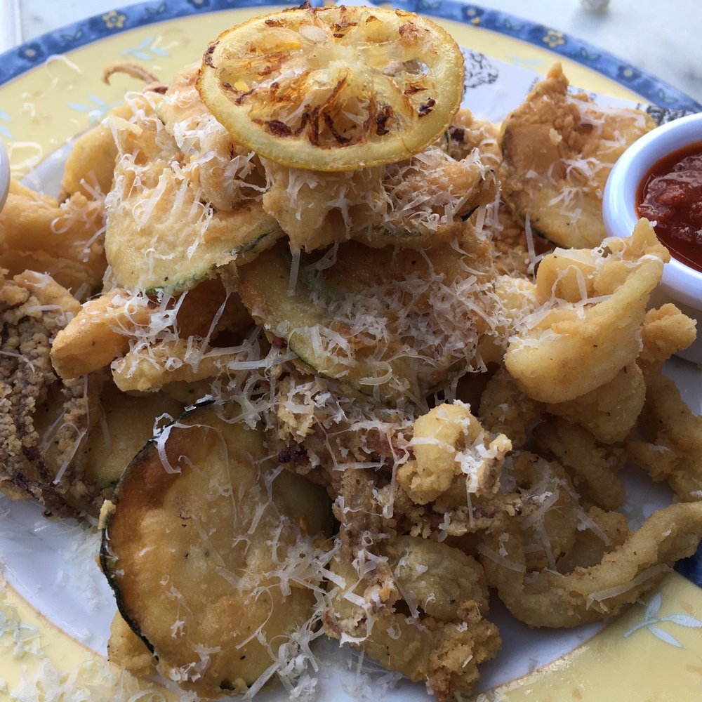 Marcella's - Calamari appetizer served with zucchini, roasted garlic aioli and marinara - Italian Near Me - Columbus, Ohio Marcella's - Calamari appetizer served with zucchini, roasted garlic aioli and marinara - Italian Near Me - Columbus, Ohio