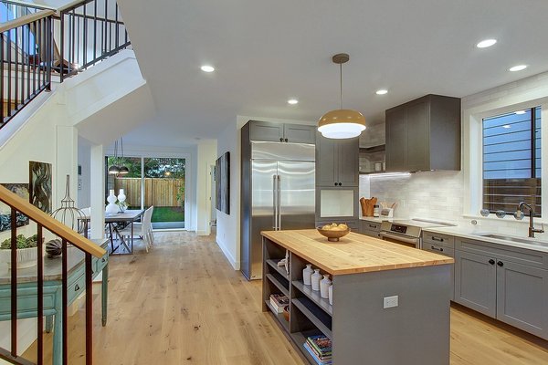 Photo of Greenhome Solutions - Seattle, WA, US. Juniper Butcher Block Countertop + Tesoro Woods White Oak FSC Hardwood Flooring in Straw by BuiltWell Co, Seattle WA
