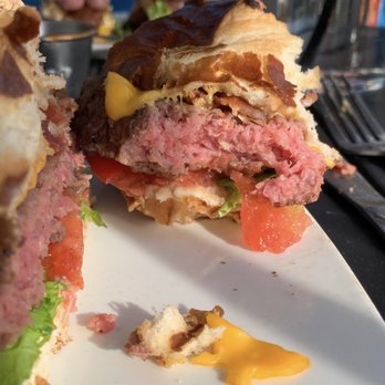 Empire - You can see it's raw and the cheese is Barley melted because it's still cold!!! The knife she used still has raw meat on it. - Burgers Near Me - Naperville, Illinois