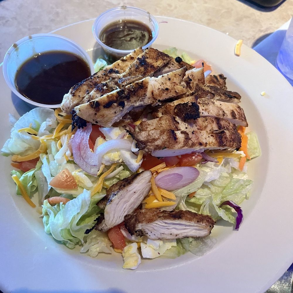 Grilled Chicken Salad no potato straws with balsamic dressing. Best he's ever had he said.