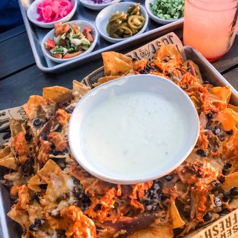 Eight Thirty Common - Old Towne Nachos (with al-Pastor carnitas and chicken tinga) -- we got the toppings on the side, but this is normally all loaded already - Gastropubs Near Me - Meridian, Idaho Eight Thirty Common - Old Towne Nachos (with al-Pastor carnitas and chicken tinga) -- we got the toppings on the side, but this is normally all loaded already - Gastropubs Near Me - Meridian, Idaho