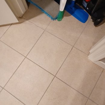 Excel Floor Care - Still drying, but you can see original color in the closet and cleaned tile next to it. - Carpet Cleaning Near Me - Gilbert, Arizona