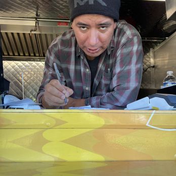 El Toro Serrano - a man writing on a piece of paper - Food Trucks Near Me El Toro Serrano - a man writing on a piece of paper - Food Trucks Near Me