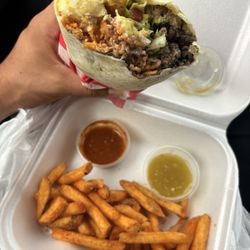 Ninos Taqueria y Mas - Carne asada burrito with guacamole and fries!