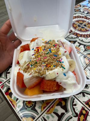 Photo of Jugos Vallarta - Santa Ana, CA, US. a hand holding a container of fruit and yogurt