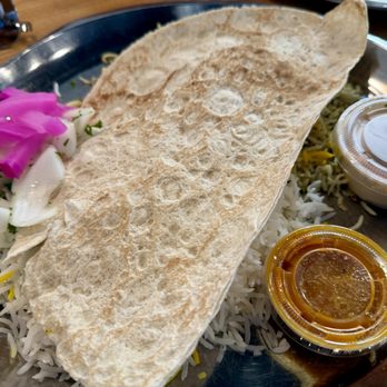 Noon O Kabab - platter to go with the meal, including rice, onions, pickled turnips, hummus, flatbread, and sauce - Persian/Iranian Near Me - Chicago, Illinois Noon O Kabab - platter to go with the meal, including rice, onions, pickled turnips, hummus, flatbread, and sauce - Persian/Iranian Near Me - Chicago, Illinois