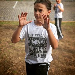 Blue Titan Fitness & Self-Defense - A member of our junior black belt class learning practical self-defense!