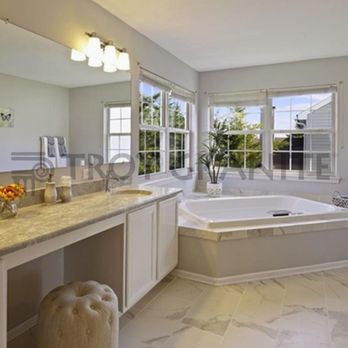 Troy Granite - Giallo Ornamental Vanity w/ a Calacatta marble Tub Surround - Kitchen & Bath Near Me - Newark, Delaware Troy Granite - Giallo Ornamental Vanity w/ a Calacatta marble Tub Surround - Kitchen & Bath Near Me - Newark, Delaware