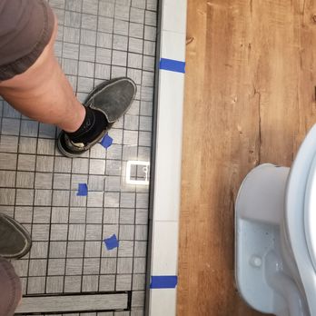 Cal Pro Contractors - shower floor puddle marked with tape - General Contractors Near Me - Fremont, California Cal Pro Contractors - shower floor puddle marked with tape - General Contractors Near Me - Fremont, California