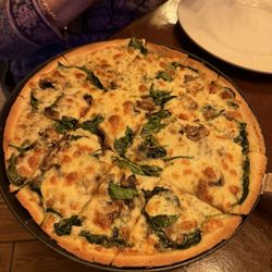Ian & Kye’s Pizza - White spinach, mushroom pizza