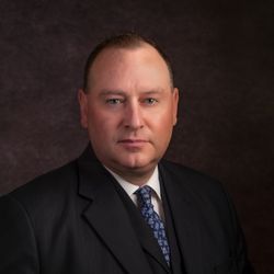 Adam D Schlein