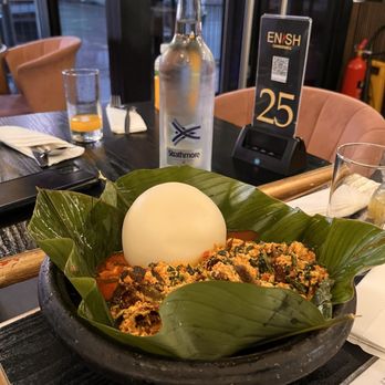 Enish Restaurant Camberwell - Pounded yam with Egusi and goat meat. Served in a heavy clay bowl - African Near Me - London, XGL