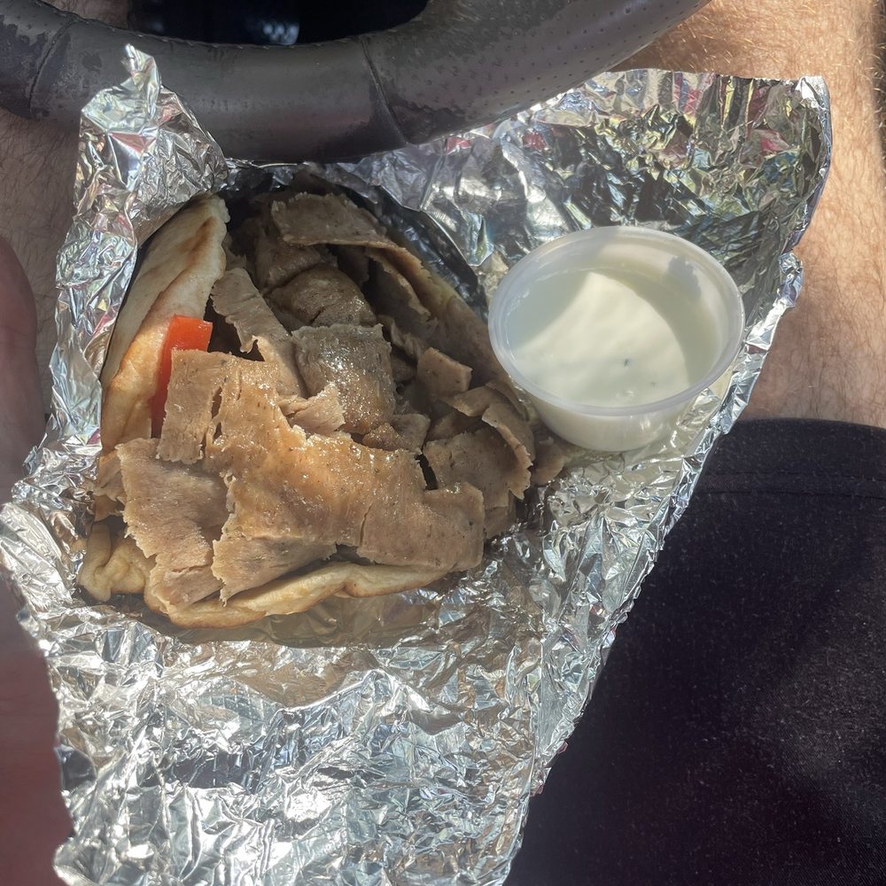 Regular gyro with onion and tomato, side of tzatziki Regular gyro with onion and tomato, side of tzatziki