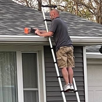 Premier Plus - Sales Representative, Wes, inspecting a homeowners roof for storm damage. - Damage Restoration Near Me - Hiawatha, Iowa Premier Plus - Sales Representative, Wes, inspecting a homeowners roof for storm damage. - Damage Restoration Near Me - Hiawatha, Iowa
