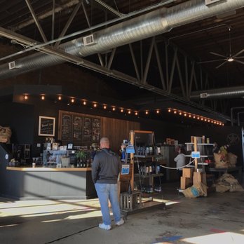 Tremont Coffee - a man standing in front of the counter - Coffee Roasteries Near Me - Massillon, Ohio