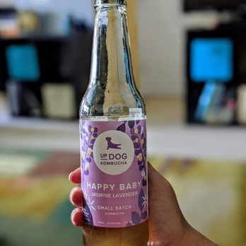 Updog Kombucha - a hand holding a bottle of kombucha - Juice Bars & Smoothies Near Me Updog Kombucha - a hand holding a bottle of kombucha - Juice Bars & Smoothies Near Me