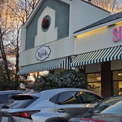 The outside of the store as the night begins to fall.