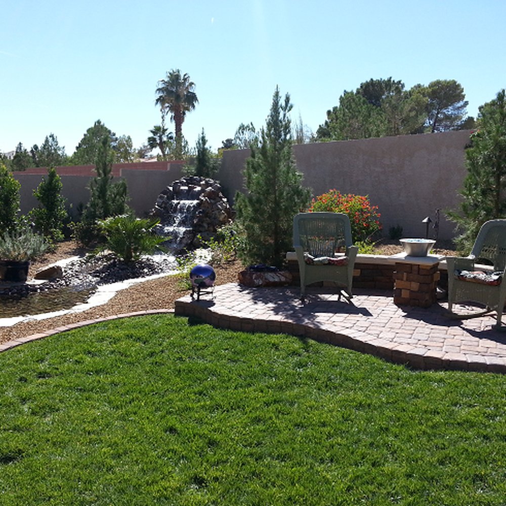 JRJ Landscape - a patio with a waterfall and lawn furniture - Landscaping Near Me JRJ Landscape - a patio with a waterfall and lawn furniture - Landscaping Near Me