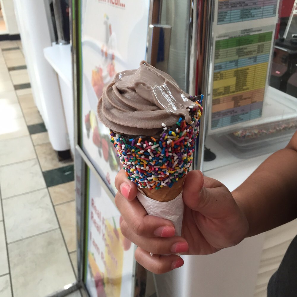 Cali Yogurt - a person holding an ice cream cone with sprinkles - Ice Cream & Frozen Yogurt Near Me - Orlando, Florida Cali Yogurt - a person holding an ice cream cone with sprinkles - Ice Cream & Frozen Yogurt Near Me - Orlando, Florida