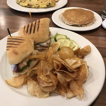 Brunch Cafe-Niles - Turkey avocado panini with homemade potato chips and garden omelet with brunch potatoes and multigrain pancakes. - Breakfast & Brunch Near Me - Niles, Illinois